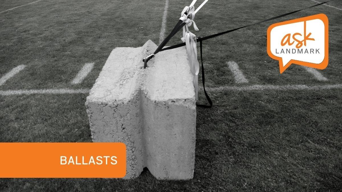 Ballasts FAQs sheet cover - tether strap from custom inflatable attached to cement block 