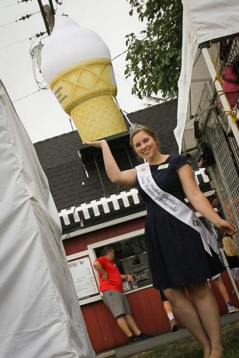custom inflatable ice cream cone with model at fairgrounds